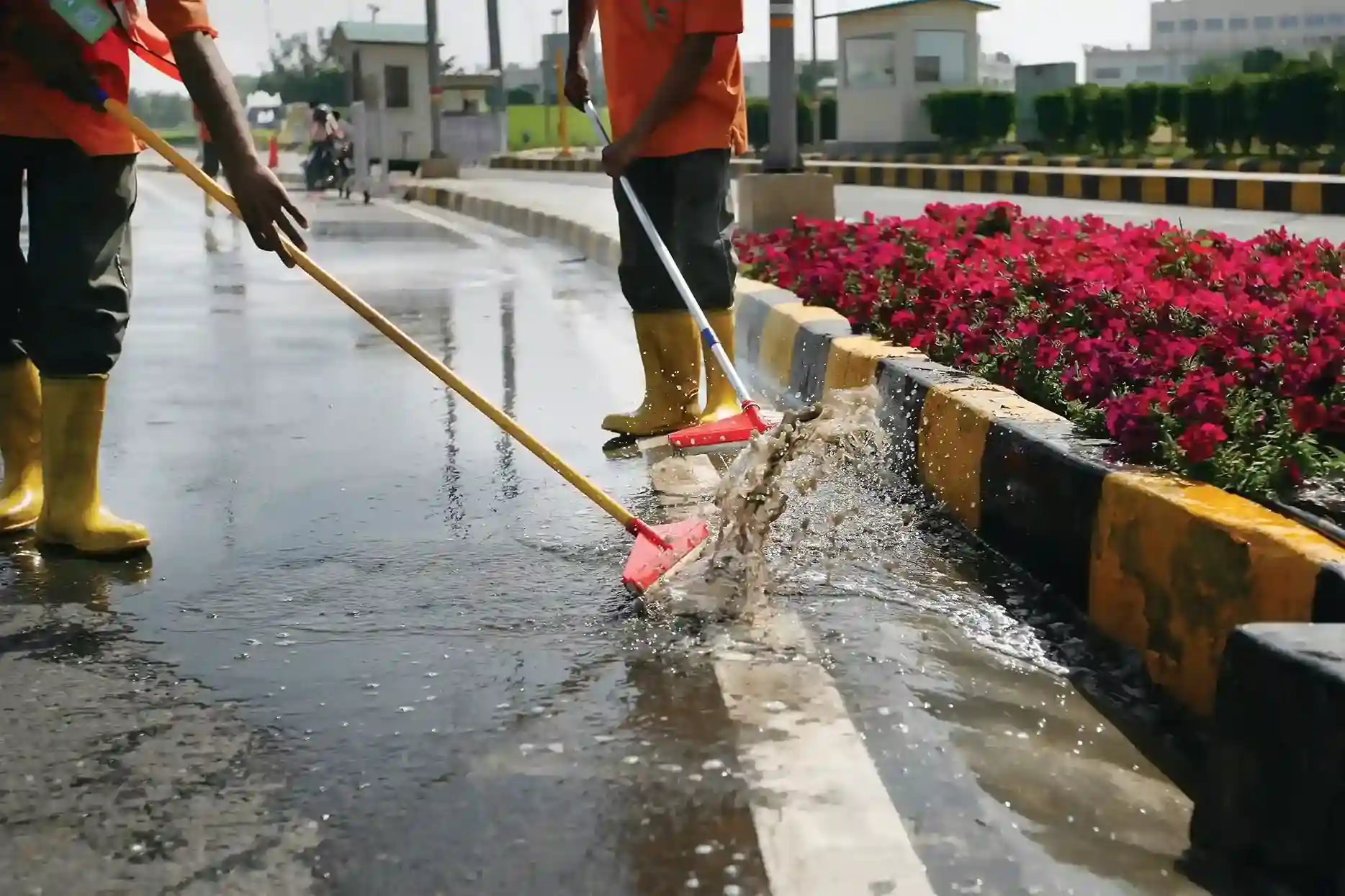 men cleaning the road